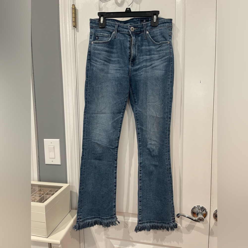 Boot cut jeans with distress on ankles dark wash